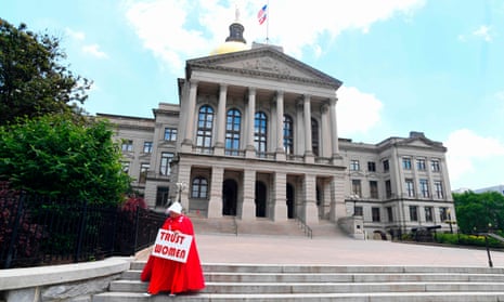 An activist, Tamara Stevens, leaves the Georgia capitol after an event opposing abortion legislation.