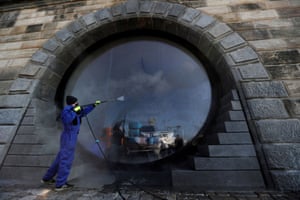 Prague, Czech Republic. A municipality worker sprays a disinfectant along the Vltava river to curb the spread of the coronavirus
