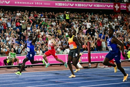 Britain’s Romell Glave (left) celebrates as he crosses the finish line to win the men’s 100m final.