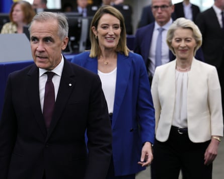 Mark Carney, Roberta Metsola and Ursula von der Leyen walk through the European parliament building