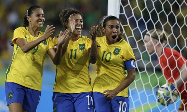 Brazil’s Andressa Alves, left, Cristiane, center, and Marta celebrate after their side’s second goal during a group E match of the women’s Olympic football tournament against Sweden in Rio De Janeiro.