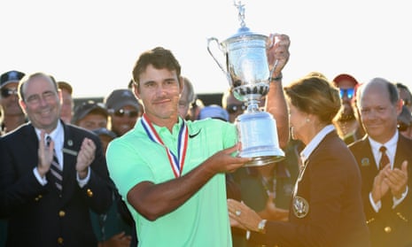 Brooks Koepka celebrates with the US Open trophy