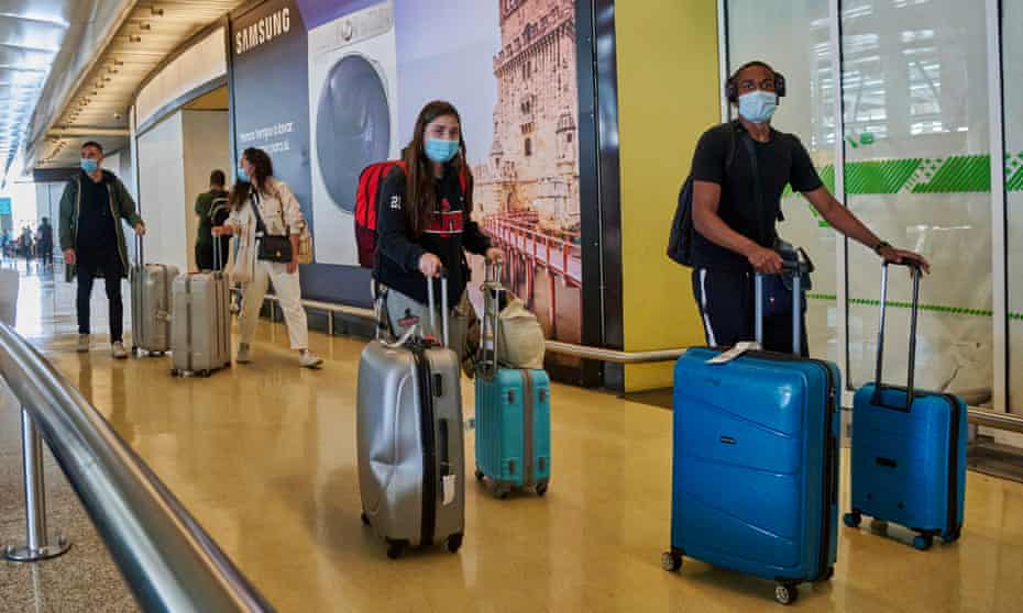 Travellers arrive at Lisbon airport