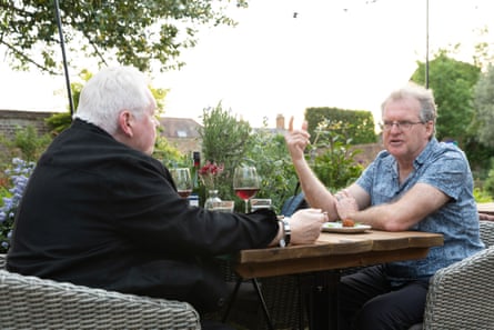 Don and David chatting at an outside restaurant table