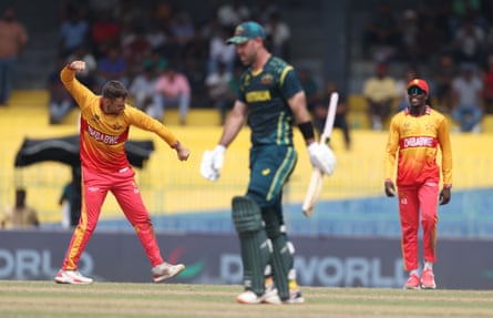 Ryan Burl of Zimbabwe celebrates the wicket of Glenn Maxwell.