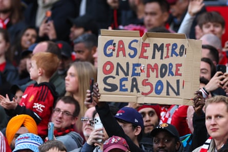 Fans hold up a banner pleading with Casemiro to stay