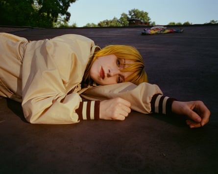 The musician Hayley Williams laying on the ground