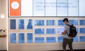 A customer picks up his order from computerized cubbies at Eatsa, an automated restaurant in San Francisco.