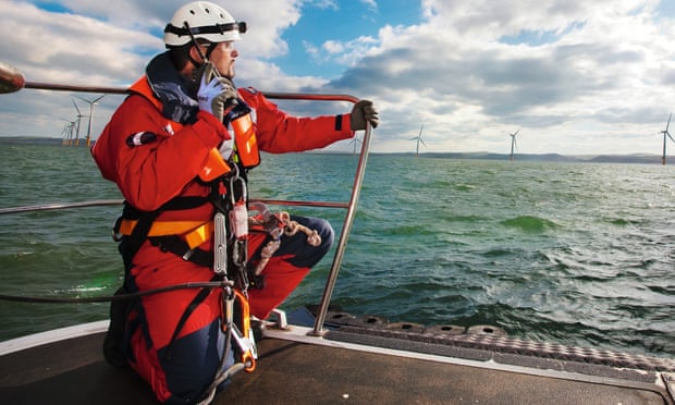 An engineer prepares to inspect npower wind turbines near Beaumaris Pier, off Anglesey in Wales.