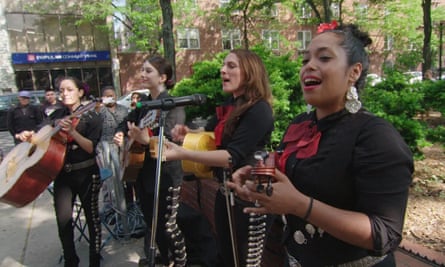 A female band playing in the street.