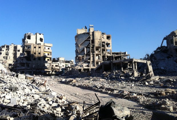 Destroyed buldings in the Khaldiyeh district of Syria’s central city of Homs, July 2013.