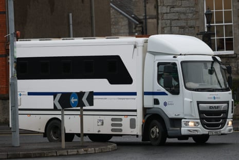 A white van arriving at court.