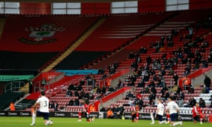 Southampton and Manchester City players take a knee as fans watch from the stands at St Mary’s.