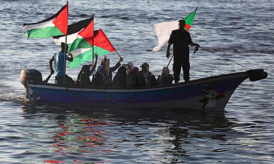 People from Gaza take to the water to protest against the interception of the Dutch-registered vessel