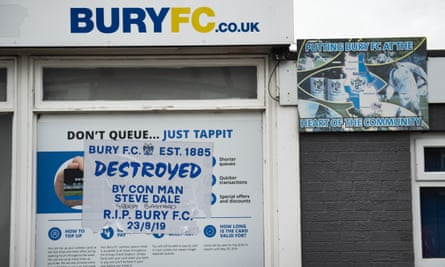 Fans’ anger is expressed on a poster outside Gigg Lane.