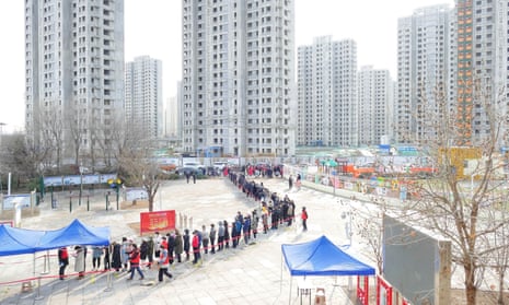 People line up for Covid testing in the Chinese port city of Tianjin, which is testing its population of 14 million.