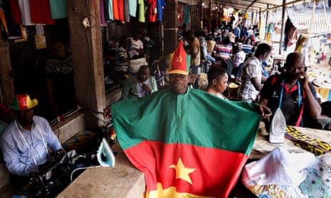 A tailor from the central market in the capital, Yaoundé, shows his support for the Cameroon team