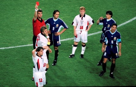 David Beckham is sent off by Kim Milton Nielsen after kicking out at Diego Simeone.