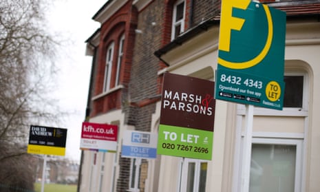 To Let estate agent signs outside terraced houses