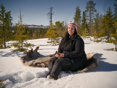 Susanna Israelsson sits in snowy forested area