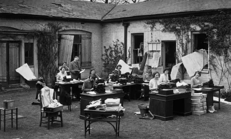 Typists at work in Regents Park, London, during the second world war after a bombing raid destroyed their office. Photograph: Getty