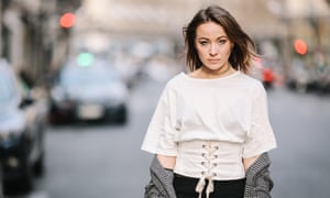 Model Amelie Lloyd wears a lace corset top during Paris fashion week.