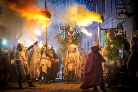 Street festival with flames and people dressed as animals in a kind of ancient ritual