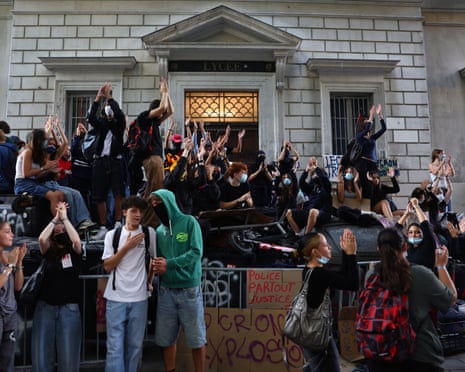 A crowd of students outside a school building