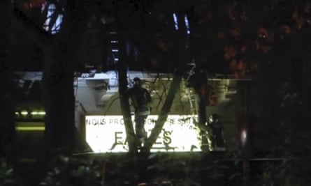 Video grab of French firefighters climbing ladders to rescue hostages at the Bataclan concert hall.