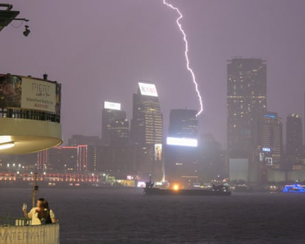 A bolt of lightning streaks across the night sky over Hong Kong