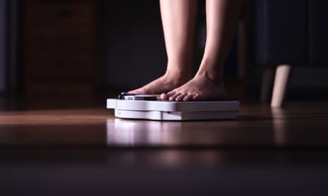 Woman's feet on weighing scales