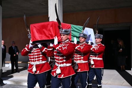 Bulgaria’s military personnel carry a coffin draped in the Bulgarian flag