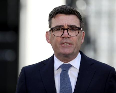 Andy Burnham in a dark suit and glasses speaks outdoors with a blurred background