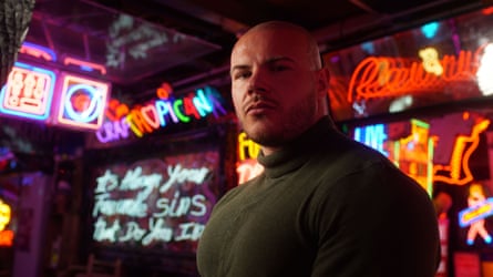 still from Confessions Of A Steroid Gang with man in a room full of neon signs