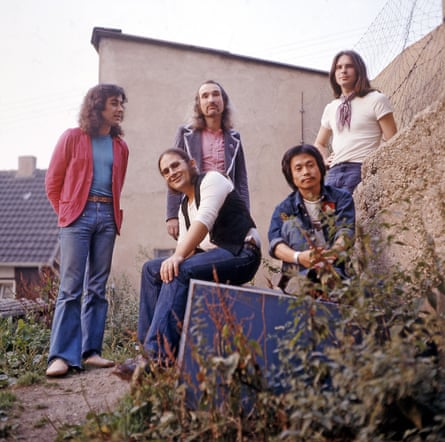The five members of Can posing outdoors