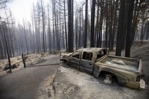A charred pickup truck whose wheels melted in the blaze