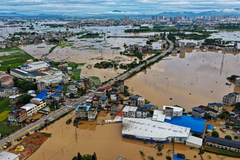 Buildings and trees submerged in floodwaters