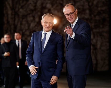 Poland's prime minister Donald Tusk is welcomed by German Chancellor Friedrich Merz at the Chancellery in Berlin.
