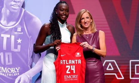 Nyadiew Puoch poses with the WNBA Commissioner Cathy Engelbert after being selected 12th by the Atlanta Dream