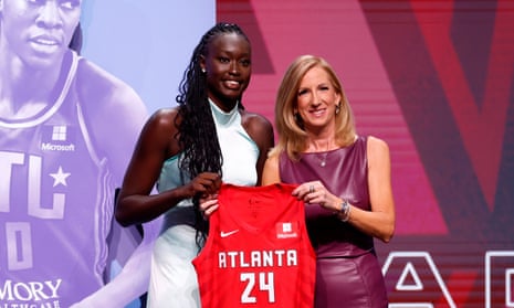 Nyadiew Puoch poses with WNBA commissioner Cathy Engelbert after being selected 12th overall pick by the Atlanta Dream during the 2024 WNBA draft.