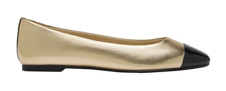 Gold ballet flats with black toe