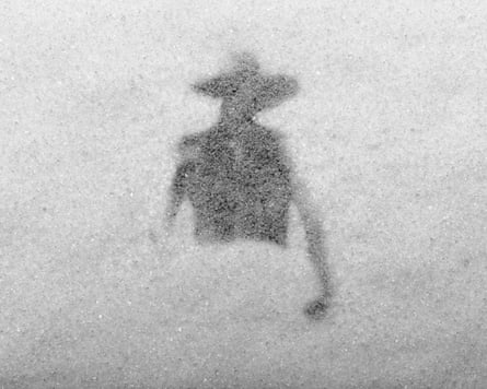 A sugar image of the top half of a person in silhouette