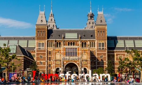 The Rijksmuseum and IAmsterdam sign and the facade of the Rijksmuseum after the 2014 renovations; seen on a sunny summer day with blue sky.