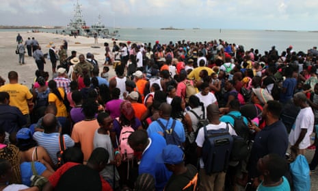 People wait in Marsh Harbour Port to be evacuated to Nassau, in Abaco on Friday. The evacuation is slow and there is frustration for some who said they had nowhere to go after the Hurricane Dorian splintered whole neighborhoods. (AP Photo/Gonzalo Gaudenzi)