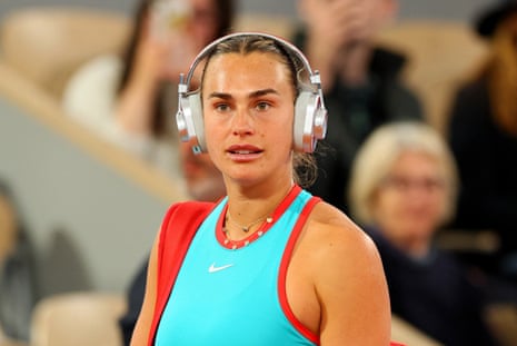 sabalenka in blue and headphones