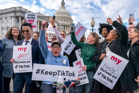 people hold signs that read “keep tiktok”