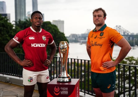 British & Irish Lions captain Maro Itoje and Australian captain Harry Wilson pose either side of the trophy