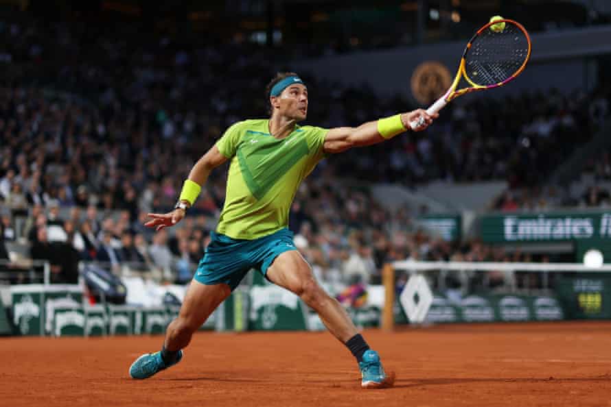 Rafael Nadal stretches to play a backhand as he takes the first set in his quarter-final against Novak Djokovic.