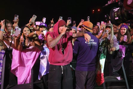 He mingles with the crowd while performing