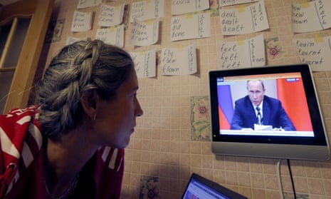 Woman watches Russian news programme